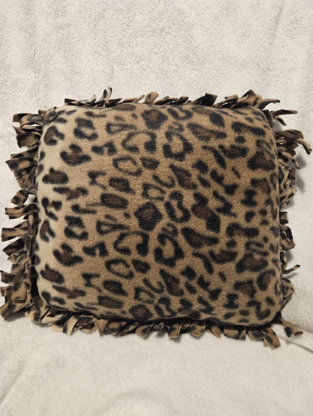 Handmade no sew leopard fleece accent pillow.  Machine washable,